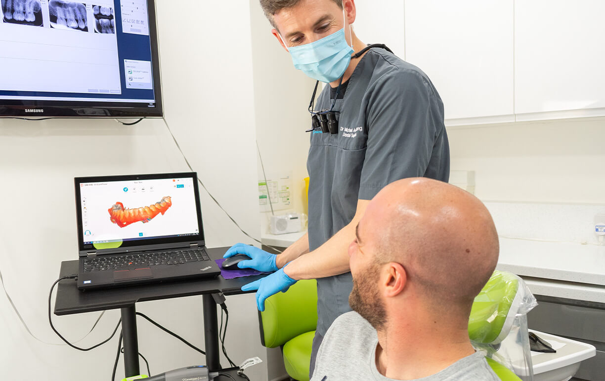 man smiling at invisalign appointment at bridgford dental