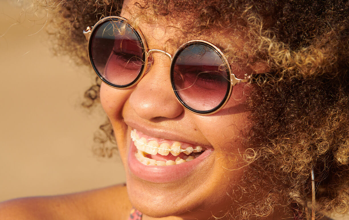 smiling woman with braces on