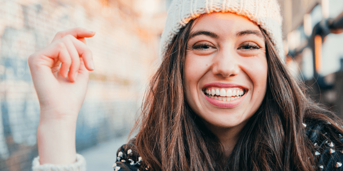 woman smiling after invisalign treatment at bridgford dental