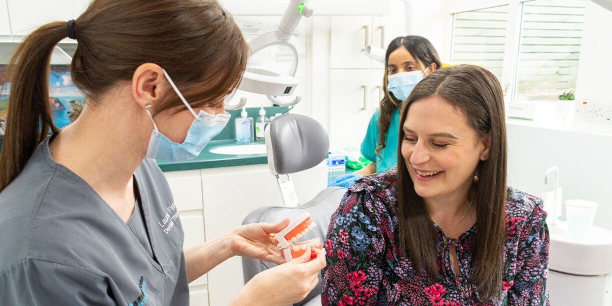 Woman smiling at her first dental visit at Bridgford Dental Practice